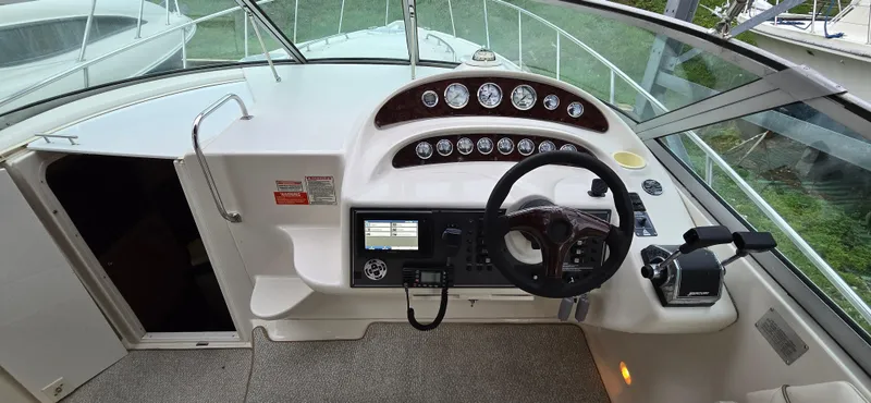 Slide: The Image of 2002 Monterey 322 Cruiser helm with steering wheel and instrument panel. - 12