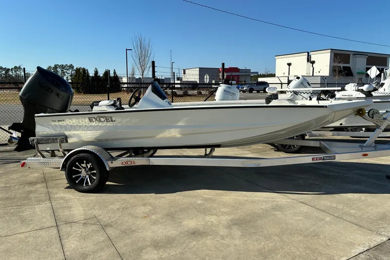 The Image of 2025 Excel 183 Bolt boat on trailer, parked outdoors under clear sky. - 5