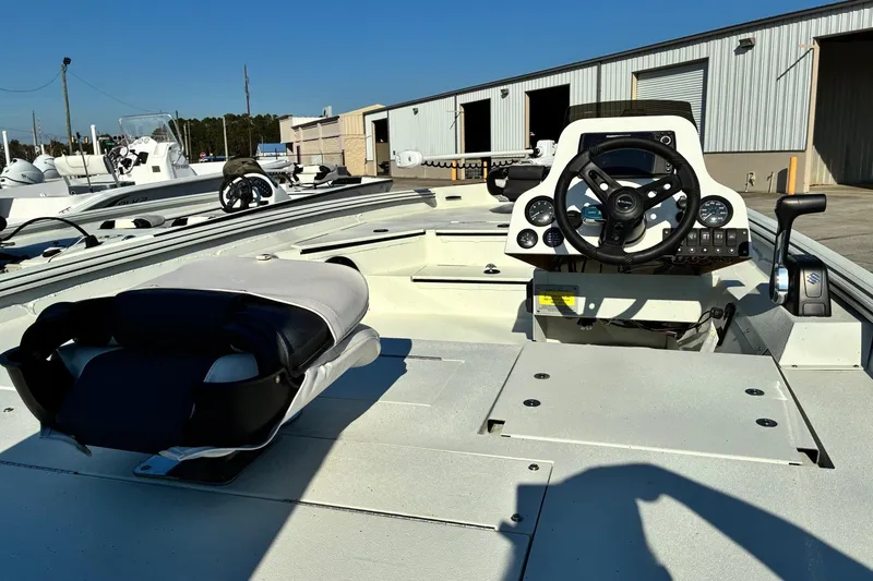 Slide: The Image of 2025 Excel 183 Bolt boat interior with steering wheel and seating. - 9