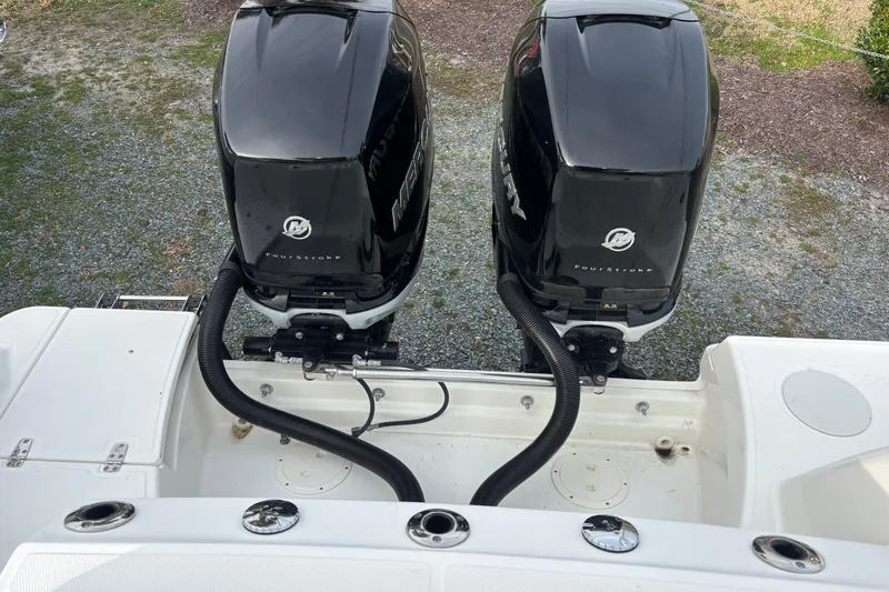 Slide: The Image of Twin Mercury outboard engines on a 2018 Boston Whaler 250 Outrage boat. - 10