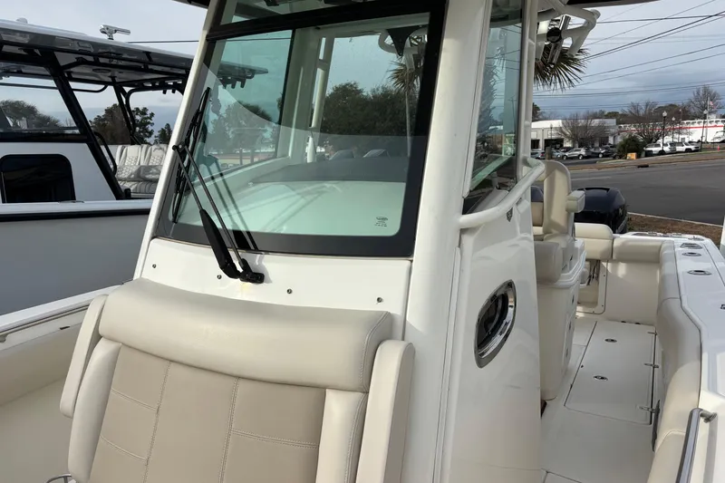 Slide: The Image of 2018 Boston Whaler 250 Outrage boat with sleek design and spacious seating. - 11