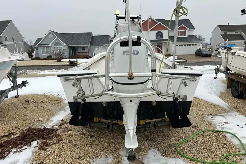 Slide: The Image of 2001 May-Craft 1900CC boat on trailer in residential area, winter setting. - 1