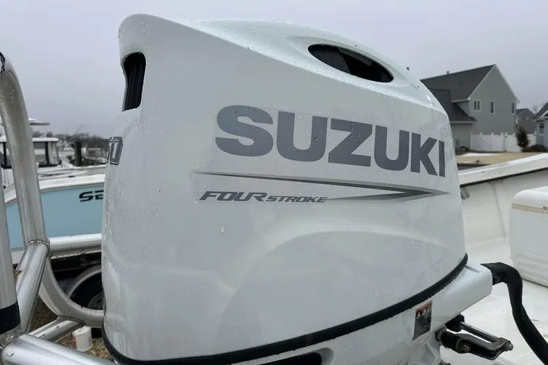 Slide: The Image of Suzuki four-stroke outboard motor on a 2001 May-Craft 1900CC boat. - 4