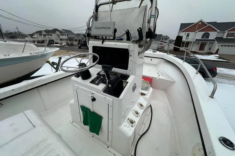 Slide: The Image of 2001 May-Craft 1900CC boat with Garmin navigation system, docked in a residential area. - 5