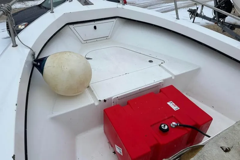 Slide: The Image of 2001 May-Craft 1900CC boat interior with red fuel tank and white buoy. - 6