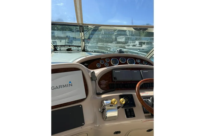 Slide: The Image of Cockpit view of 2000 Sea Ray 410 Express Cruiser with Garmin navigation system. - 23