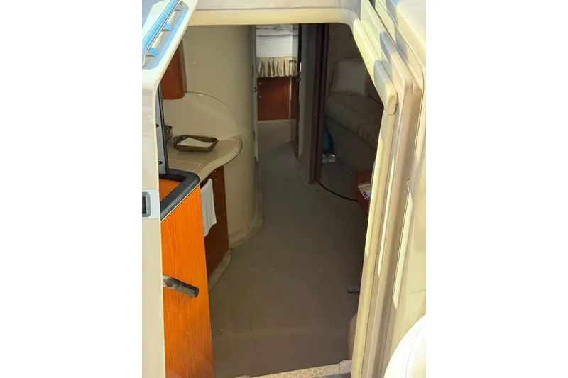 Slide: The Image of Interior view of 2000 Sea Ray 410 Express Cruiser, featuring cabin entrance and seating area. - 42
