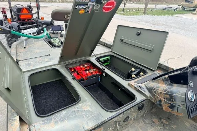 Slide: The Image of 2017 Ranger RT188 boat with open storage compartments and batteries. - 10