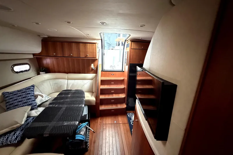 Slide: The Image of Luxurious interior of 2006 Tiara Yachts 4300 Sovran with elegant wood finishes and cozy seating. - 11