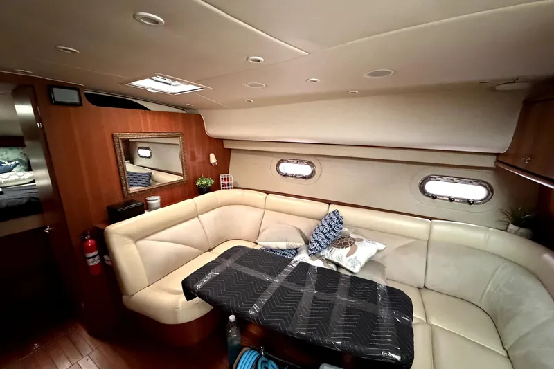 Slide: The Image of Luxurious interior of 2006 Tiara Yachts 4300 Sovran with plush seating and elegant decor. - 12