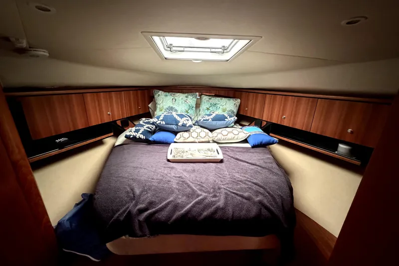 Slide: The Image of Luxurious cabin interior of 2006 Tiara Yachts 4300 Sovran with cozy bedding. - 13
