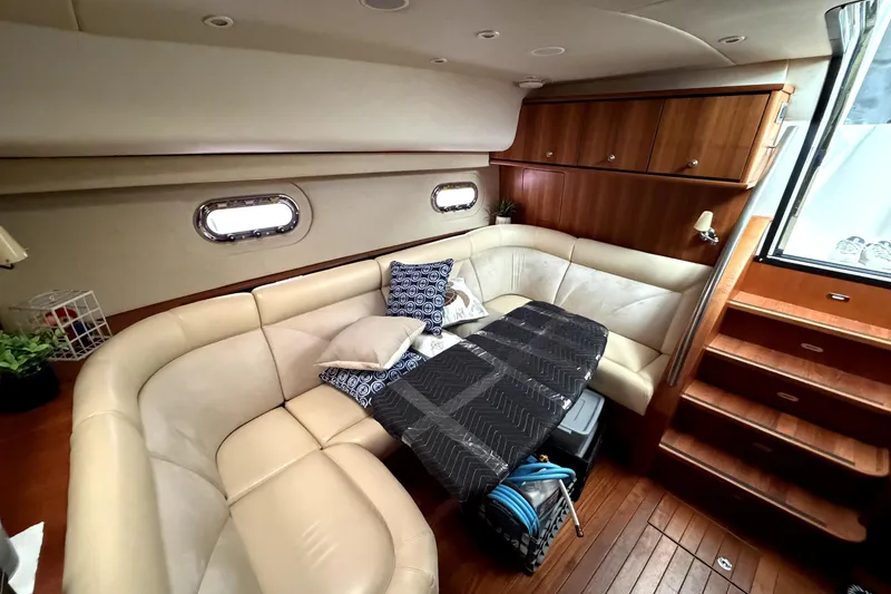 Slide: The Image of Luxurious interior of 2006 Tiara Yachts 4300 Sovran with plush seating and elegant wood finishes. - 9