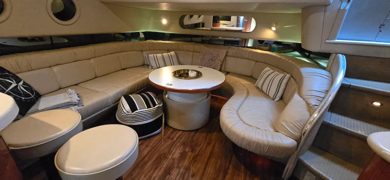 Slide: The Image of Luxurious interior of 1999 Sea Ray 50 Sundancer yacht with plush seating and elegant decor. - 14