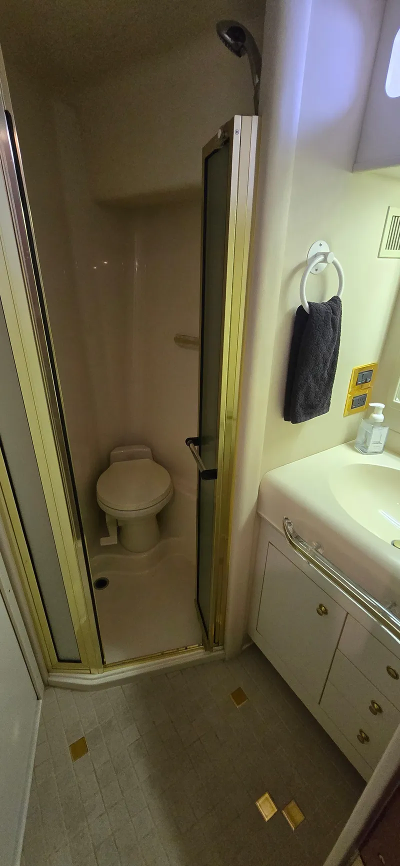 Slide: The Image of Bathroom interior of 1999 Sea Ray 50 Sundancer yacht with shower and sink. - 19