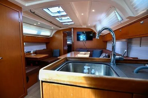 Slide: The Image of Interior of 2016 Bavaria Cruiser 41 yacht with modern kitchen and seating area. - 17