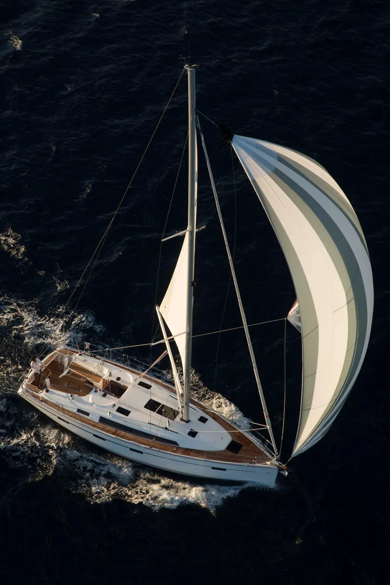 Slide: The Image of 2016 Bavaria Cruiser 41 yacht docked at marina under clear blue sky. - 2