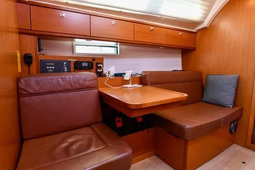 Slide: The Image of Interior of 2016 Bavaria Cruiser 41 yacht with wooden cabinetry and leather seating. - 20