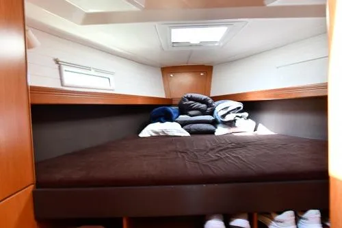Slide: The Image of Cozy cabin interior of 2016 Bavaria Cruiser 41 yacht with neatly arranged bedding. - 22
