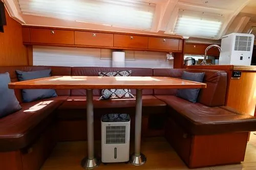 Slide: The Image of Interior of 2016 Bavaria Cruiser 41 yacht with cozy seating and wooden table. - 24
