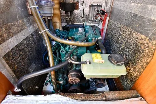 Slide: The Image of Engine compartment of a 2016 Bavaria Cruiser 41 sailboat, showcasing mechanical components. - 29