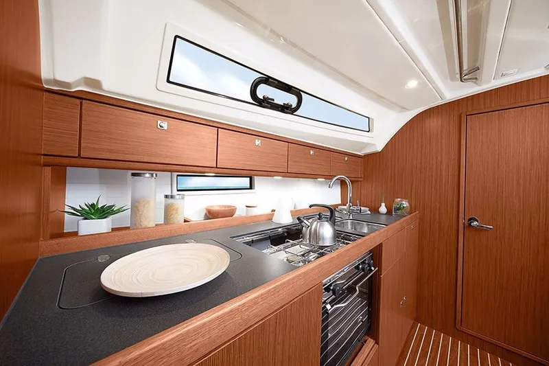 Slide: The Image of Mast of 2016 Bavaria Cruiser 41 sailboat against clear blue sky. - 9