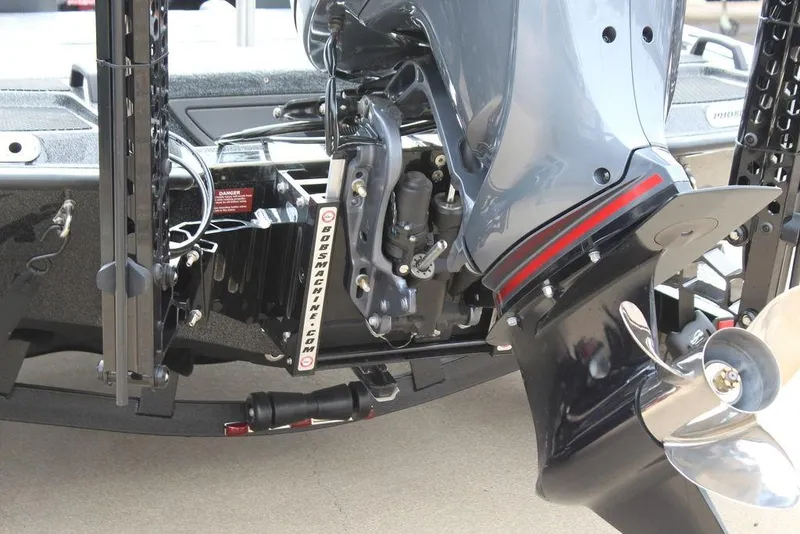 Slide: The Image of Rear view of a 2026 Phoenix 920 Elite X boat motor and propeller. - 10