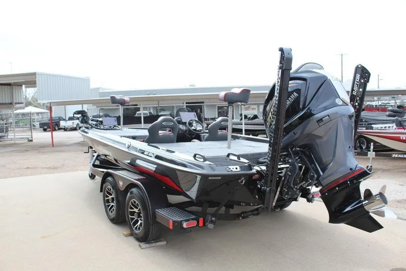 Slide: The Image of 2026 Phoenix 920 Elite X boat with powerful outboard motor and sleek design. - 11