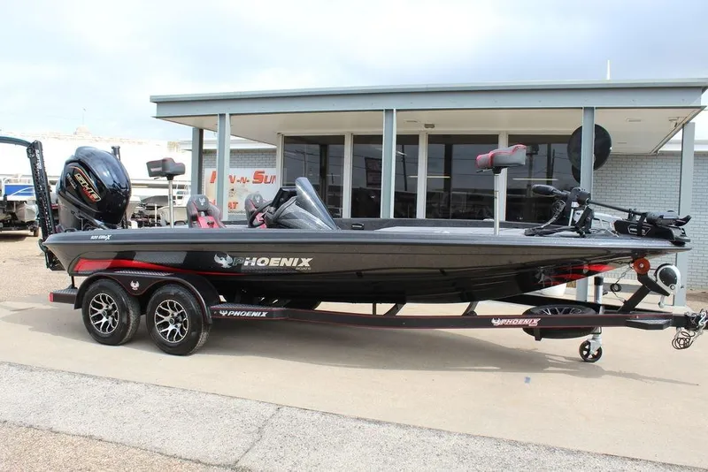 Slide: The Image of 2026 Phoenix 920 Elite X boat on trailer, parked outside a building. - 5