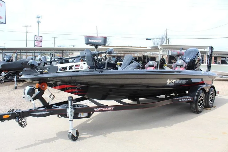Slide: The Image of 2026 Phoenix 920 Elite X boat on trailer, sleek design, dual seats, powerful engine. - 7