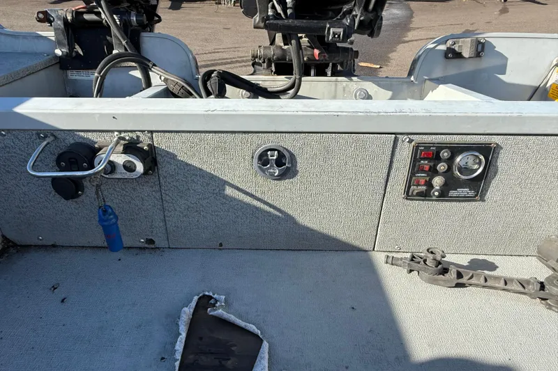 Slide: The Image of 2015 Smoker Craft Freedom 160 TL boat dashboard with controls and gauges. - 10