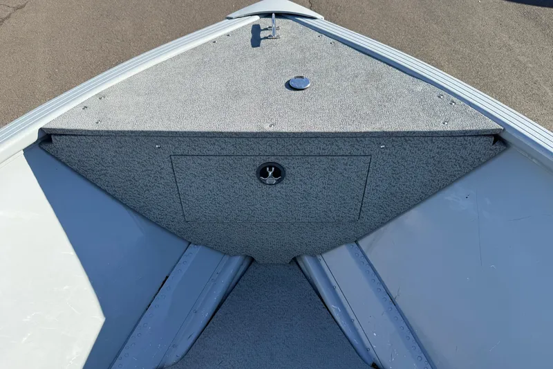 Slide: The Image of Bow area of 2015 Smoker Craft Freedom 160 TL boat with storage compartment. - 12