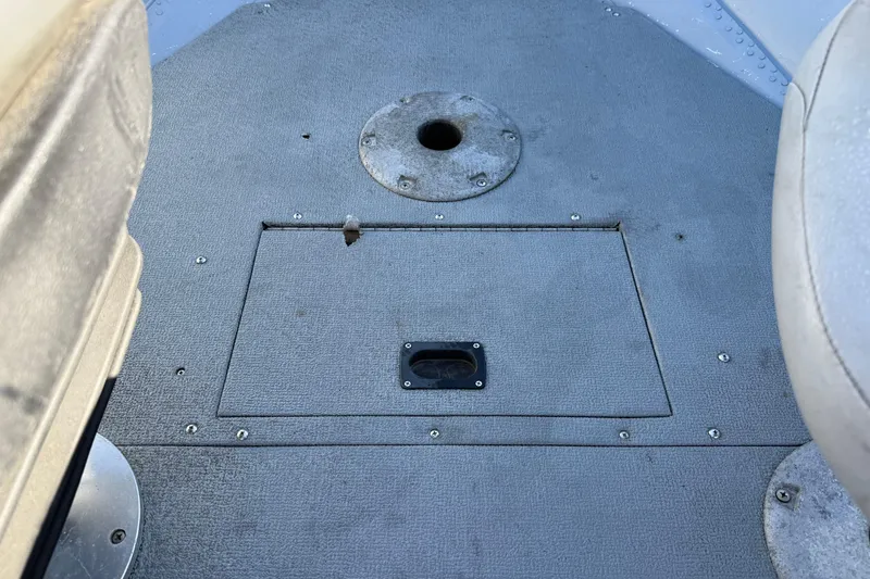 Slide: The Image of 2015 Smoker Craft Freedom 160 TL boat interior with storage compartment and seat base. - 13