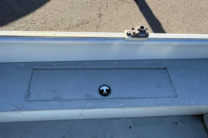 Slide: The Image of 2015 Smoker Craft Freedom 160 TL boat interior with storage compartment. - 18