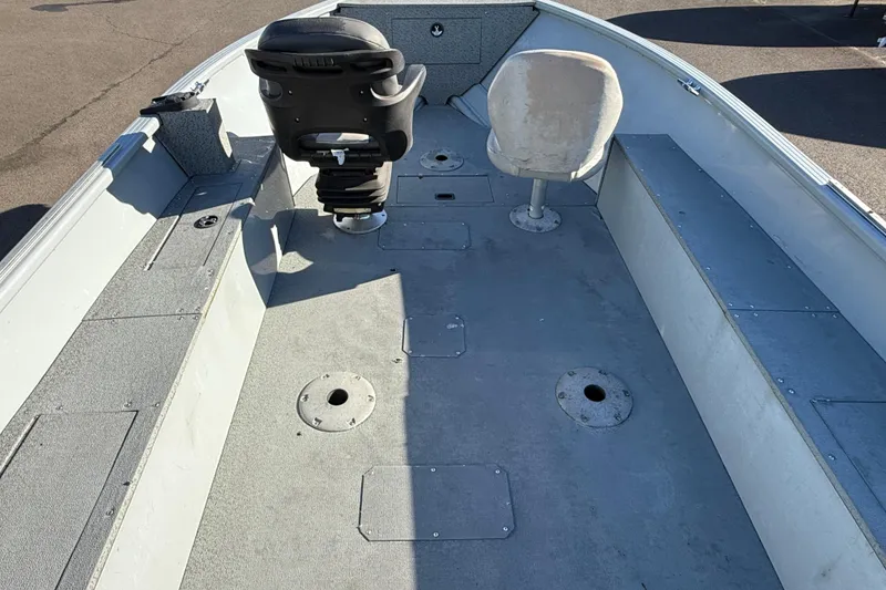 Slide: The Image of 2015 Smoker Craft Freedom 160 TL boat interior with seating and storage compartments. - 21