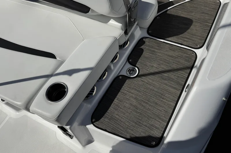 Slide: The Image of 2023 Four Winns HD3 boat interior with cushioned seating and cup holder. - 10