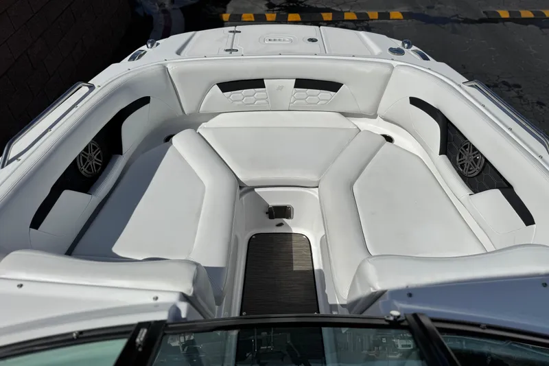 Slide: The Image of 2023 Four Winns HD3 boat interior with white seating and modern design. - 15