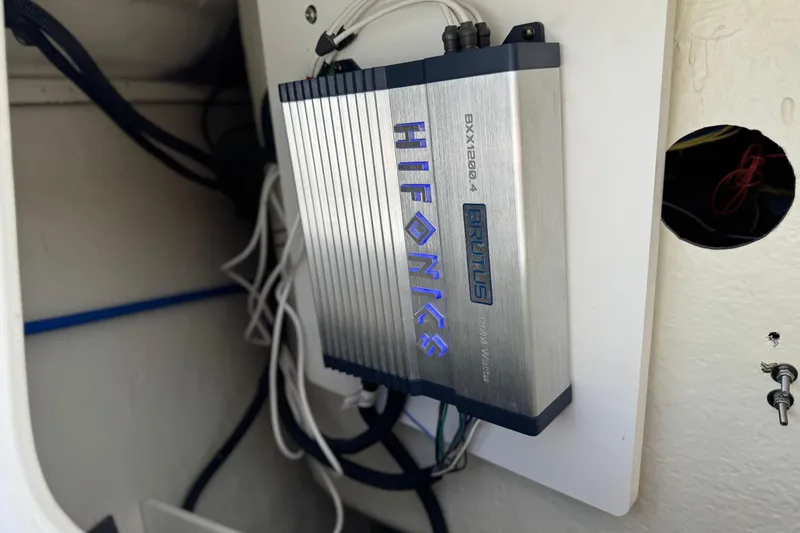 Slide: The Image of Hifonics Brutus amplifier installed in a 2023 Four Winns HD3 boat. - 19
