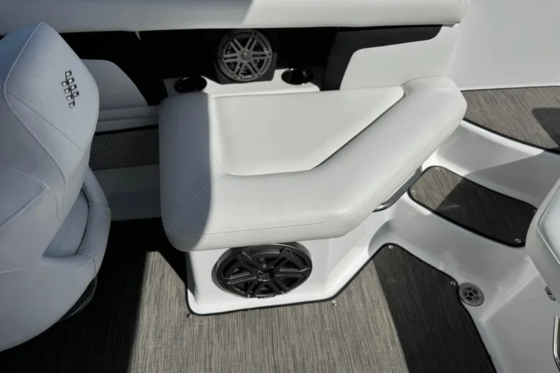 Slide: The Image of 2023 Four Winns HD3 boat interior with white seating and speaker system. - 22