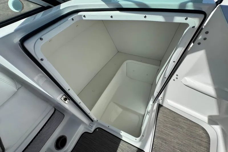 Slide: The Image of 2023 Four Winns HD3 boat storage compartment, open and spacious interior. - 32