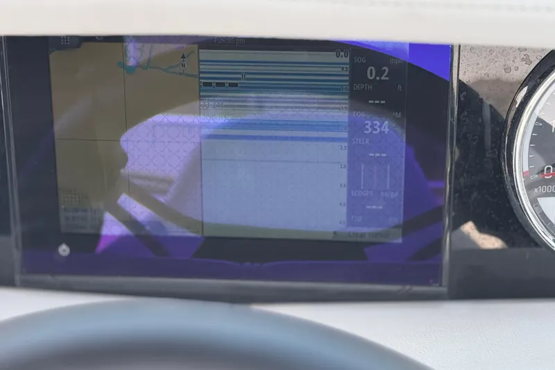 Slide: The Image of Dashboard display of a 2023 Four Winns HD3 boat, showing navigation and speed data. - 36