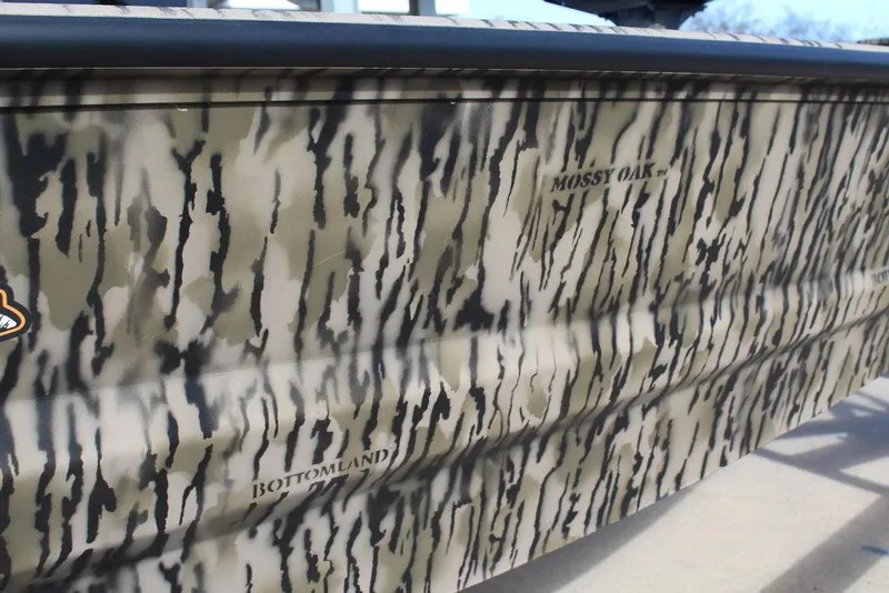 Slide: The Image of Camouflage pattern on 2026 Excel 183 Tomahawk boat with Mossy Oak Bottomland design. - 17