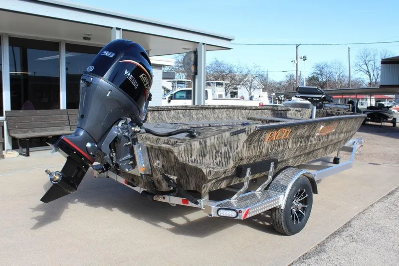 Slide: The Image of 2026 Excel 183 Tomahawk boat with Yamaha outboard motor on a trailer. - 4