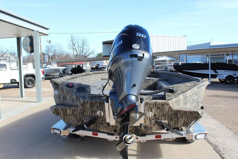 Slide: The Image of 2026 Excel 183 Tomahawk boat with Yamaha 90 engine on trailer. - 6