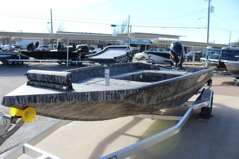 Slide: The Image of 2026 Excel 183 Tomahawk boat on trailer, displayed outdoors in a dealership lot. - 9