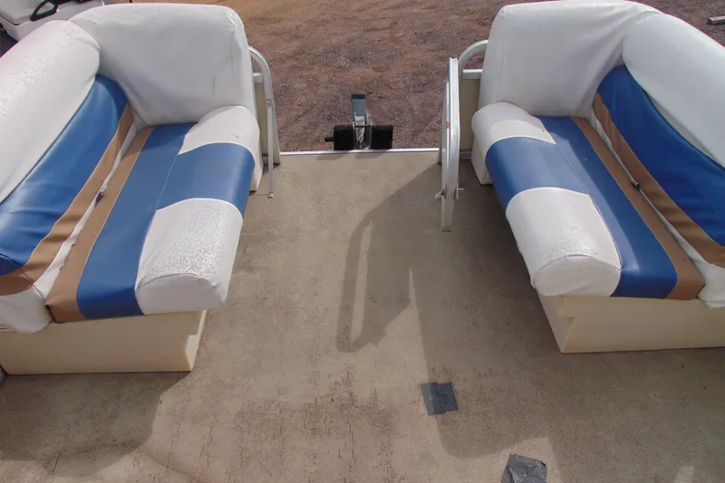 Slide: The Image of 2004 Forrest River 1903 boat interior with blue and white seating. - 6