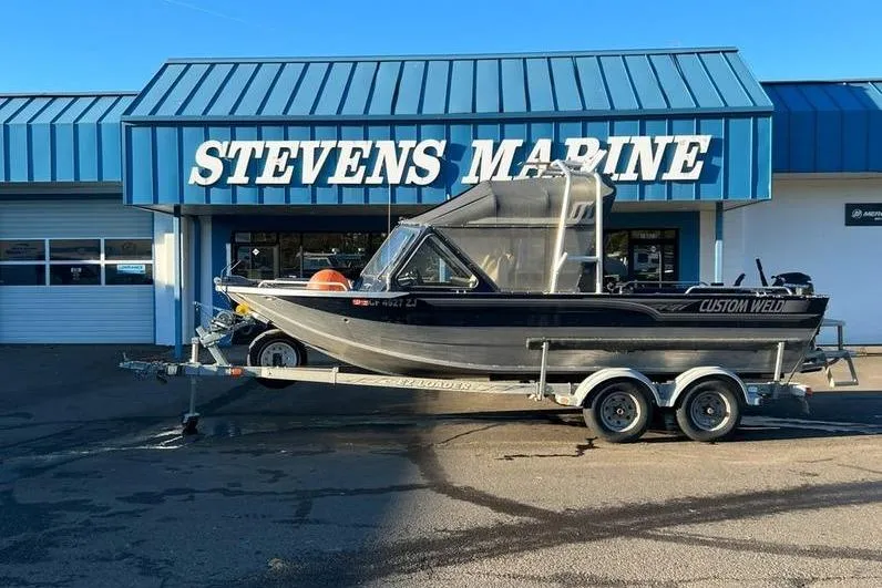 Slide: The Image of 2023 Custom Weld Cobra boat on trailer at Stevens Marine dealership. - 3