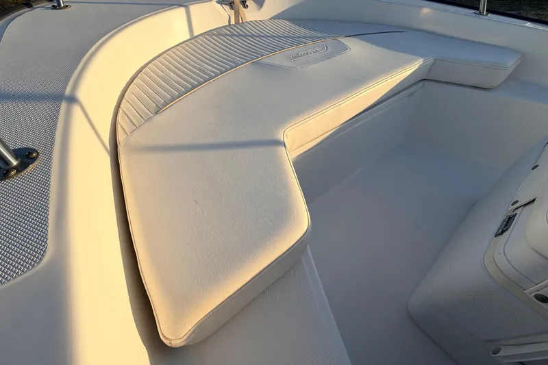 Slide: The Image of 2010 Boston Whaler 170 Montauk boat interior with cushioned seating and textured flooring. - 20