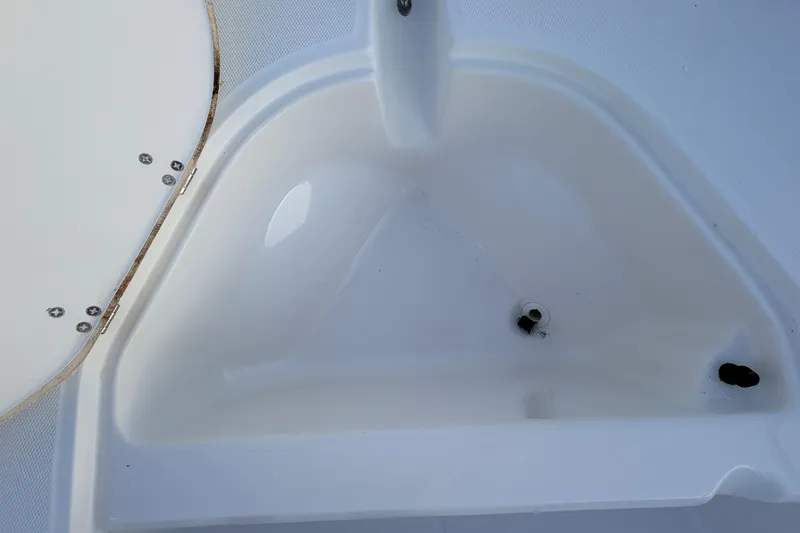 Slide: The Image of Boston Whaler 170 Montauk 2010 boat interior detail with storage compartment. - 25