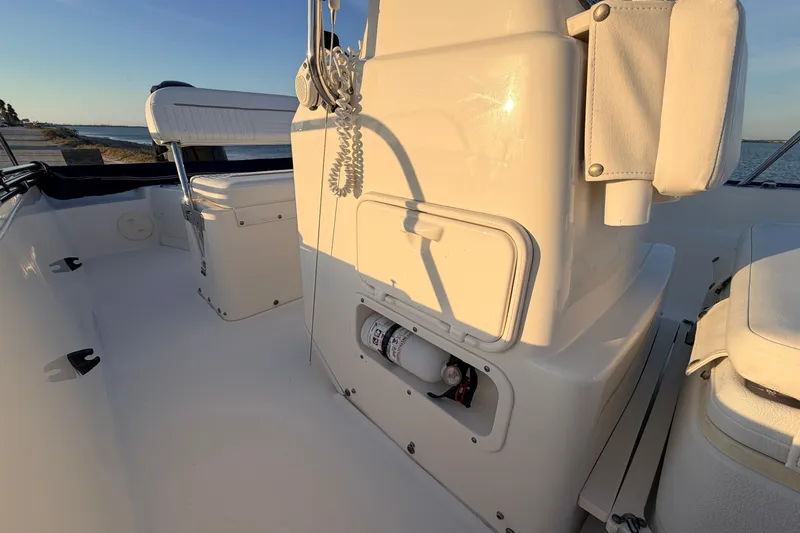Slide: The Image of 2010 Boston Whaler 170 Montauk boat interior with seating and storage compartments. - 28