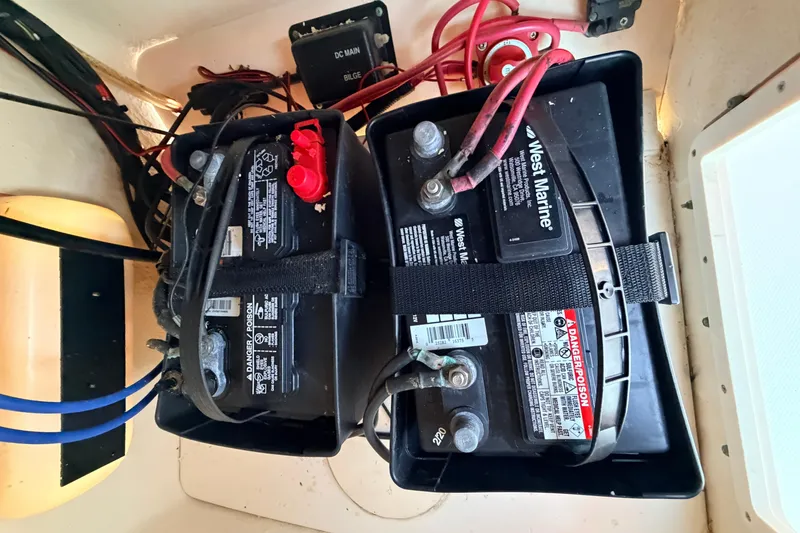 Slide: The Image of Battery compartment of a 2010 Boston Whaler 170 Montauk with West Marine batteries. - 32